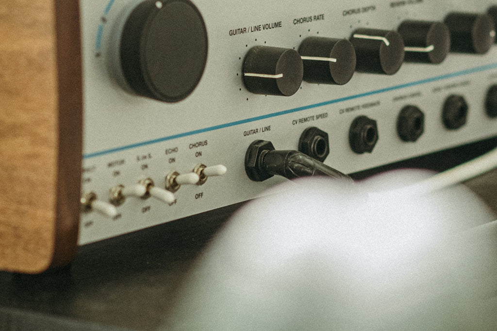 Cable plugged into the input of an outboard effects unit